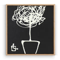 Framed black and white abstract artwork of a plant on a plain background